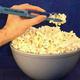 Illustration for article titled Popcorn Fork Keeps Fingers Bland